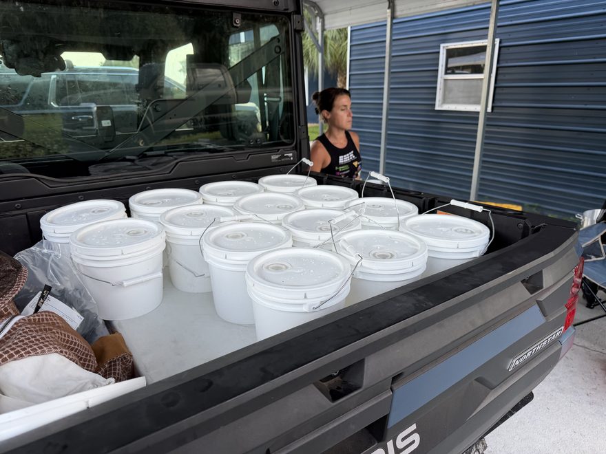 Buckets of Coastal Harvest honey loaded in the truck at Palmetto Farms